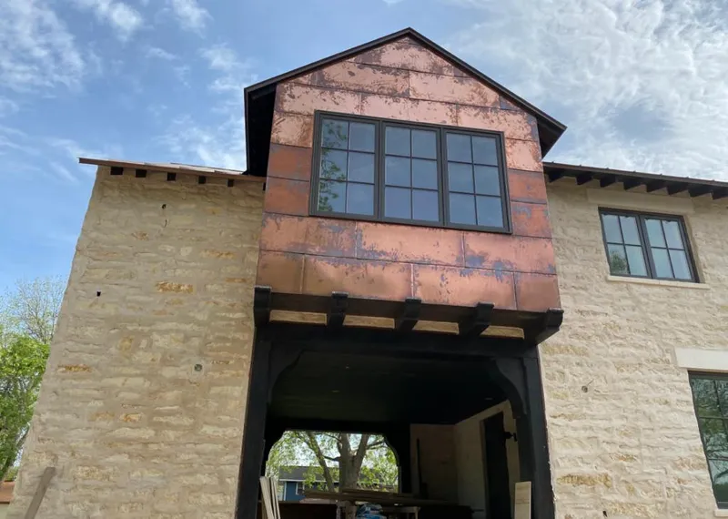 Copper metal panel facade on a stone building for Metal Roof Coating in Morristown